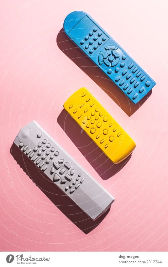 Many Colored TV remote controls on bright backgrounds Entertainment Technology Media Observe Bright Blue Yellow Pink Colour Testing & Control Remote tv many