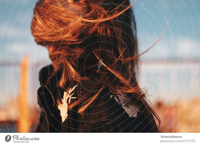 Windy hair on face. Sunset. golden hour Lifestyle Style Young woman Youth (Young adults) Hair and hairstyles 1 Human being 18 - 30 years Adults Jacket Brunette