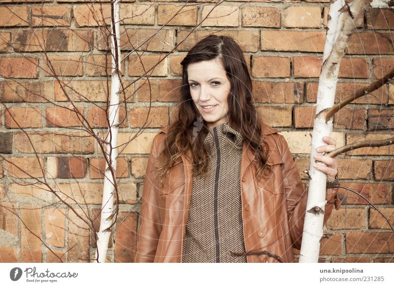 wall Feminine Young woman Youth (Young adults) Woman Adults 1 Human being 18 - 30 years Tree Birch tree Wall (barrier) Wall (building) Jacket Leather Brunette