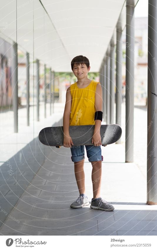 Close-up of a teenage boy carrying skateboard and smiling Lifestyle Leisure and hobbies Vacation & Travel Summer Young man Youth (Young adults) Man Adults