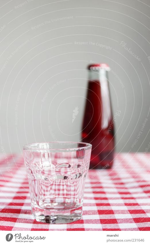 red soda Beverage Drinking Cold drink Lemonade Juice Bottle Glass Red Checkered Thirsty Tasty Sense of taste Blur Small Colour photo Interior shot Reflection
