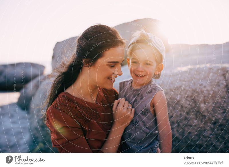 Happy mother and little boy smiling at the beach Lifestyle Joy Beautiful Leisure and hobbies Vacation & Travel Summer Beach Ocean Child Toddler Woman Adults