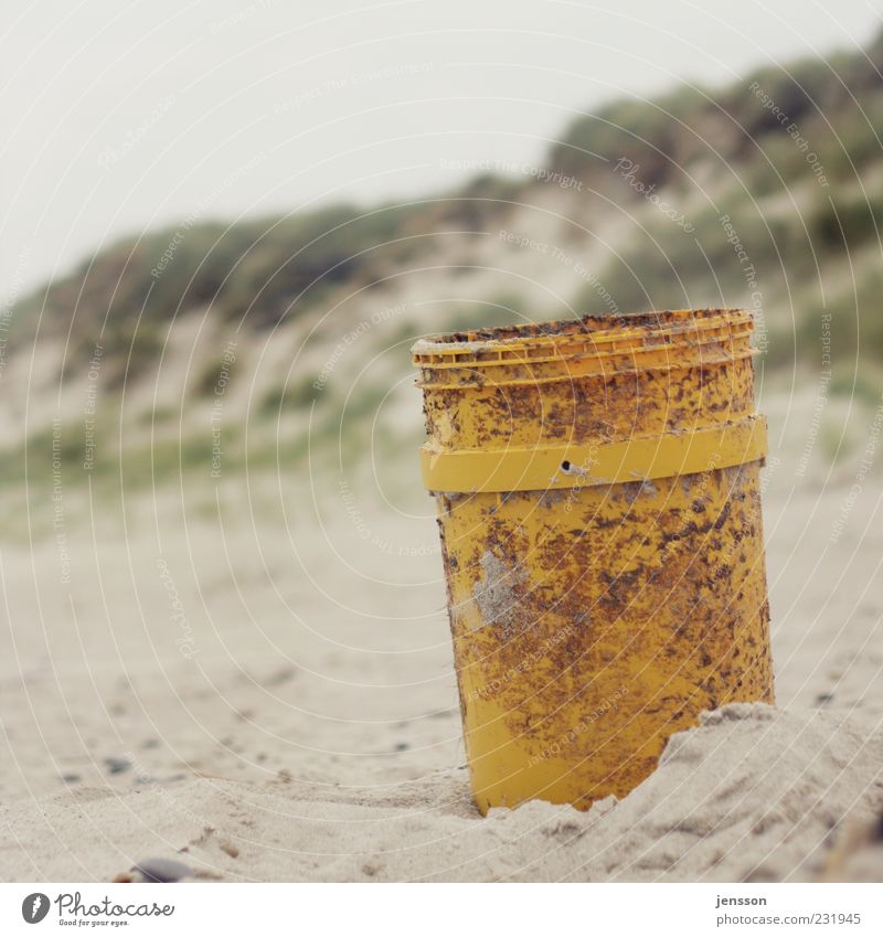 One for all and everything in the bucket Beach Environment Sand Coast Stand Gloomy Yellow Environmental pollution Flotsam and jetsam Beach dune Bucket Nature