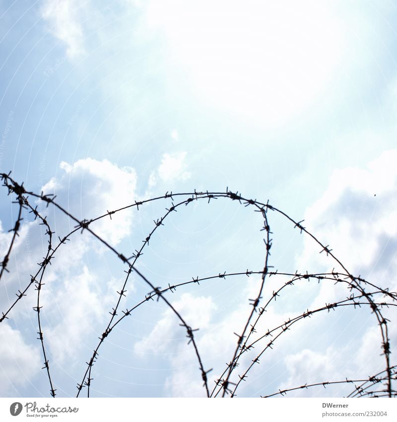 safe is safe Sculpture Sky Clouds Beautiful weather Metal Sign Illuminate Wire Barbed wire Exclusion zone Threat Terror Protective Defensive Barbed wire fence