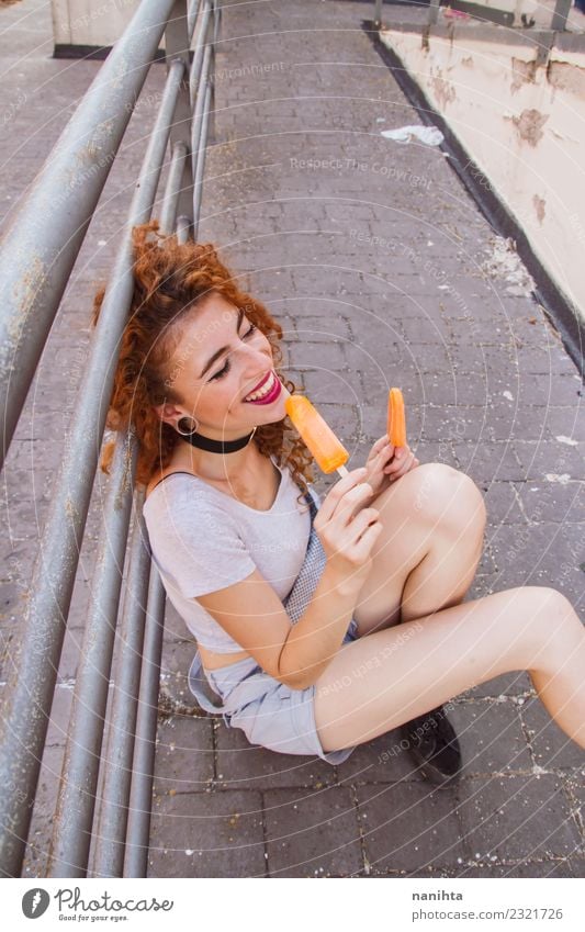 Young woman eating orange ice creams Food Ice cream Eating Lifestyle Style Joy Wellness Vacation & Travel Summer Summer vacation Human being Feminine