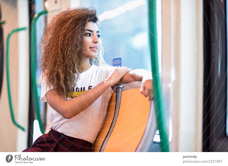 Arabic woman sitting inside subway train. Lifestyle Beautiful Hair and hairstyles Vacation & Travel Tourism Trip Human being Young woman Youth (Young adults)