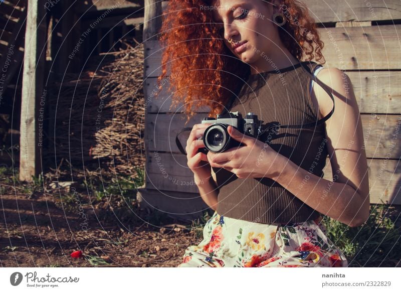 Young redhead woman holding an analog camera Lifestyle Style Hair and hairstyles Vacation & Travel Tourism Adventure Summer Summer vacation Human being Feminine