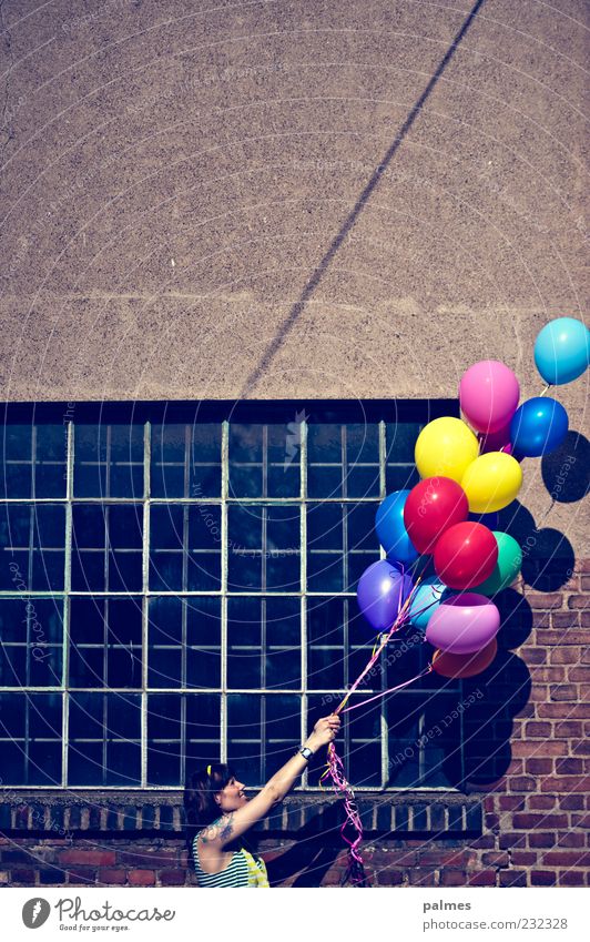 to the top right Woman Adults 1 Human being 30 - 45 years Sunlight Beautiful weather Industrial plant Factory Facade Window To hold on Multicoloured Balloon