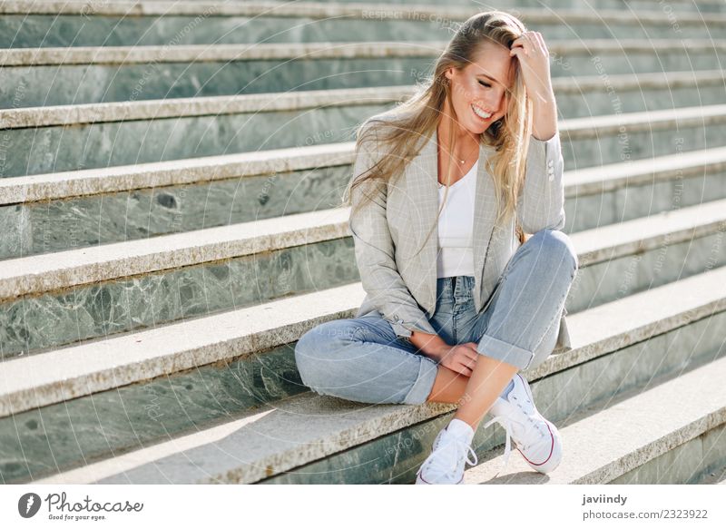 Blond woman smiling sitting in urban steps Lifestyle Beautiful Human being Feminine Young man Youth (Young adults) Woman Adults 1 18 - 30 years Street Fashion