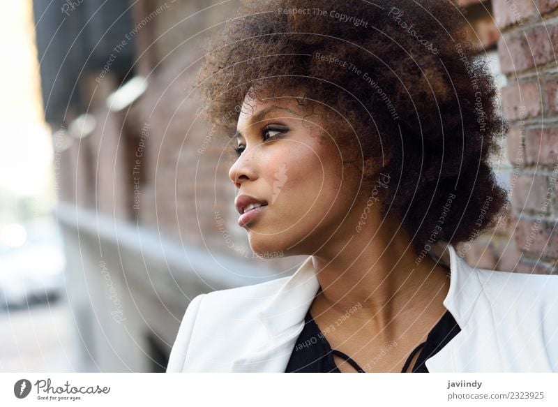Young black woman with afro hairstyle Lifestyle Style Happy Beautiful Hair and hairstyles Face Human being Woman Adults Street Fashion Jacket Brunette Afro