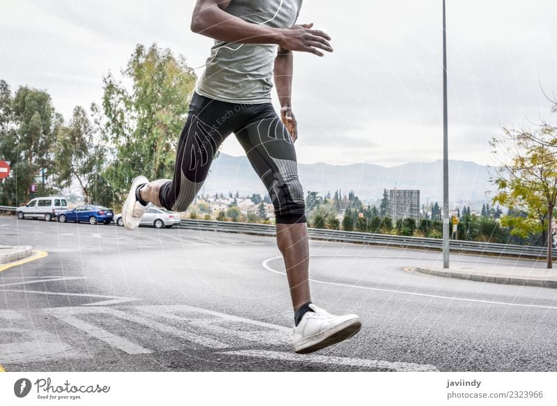 Black man running outdoors in urban road Lifestyle Body Sports Jogging Human being Feminine Young man Youth (Young adults) Man Adults Legs 1 18 - 30 years