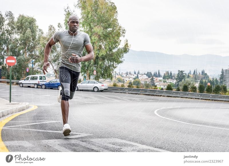 Black man running outdoors in urban road Lifestyle Body Sports Fitness Sports Training Jogging Human being Young man Youth (Young adults) Man Adults 1