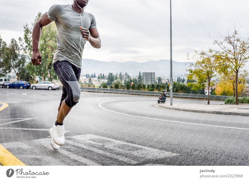 Black man running outdoors in urban road Lifestyle Body Sports Jogging Human being Masculine Young man Youth (Young adults) Man Adults 1 18 - 30 years Fitness