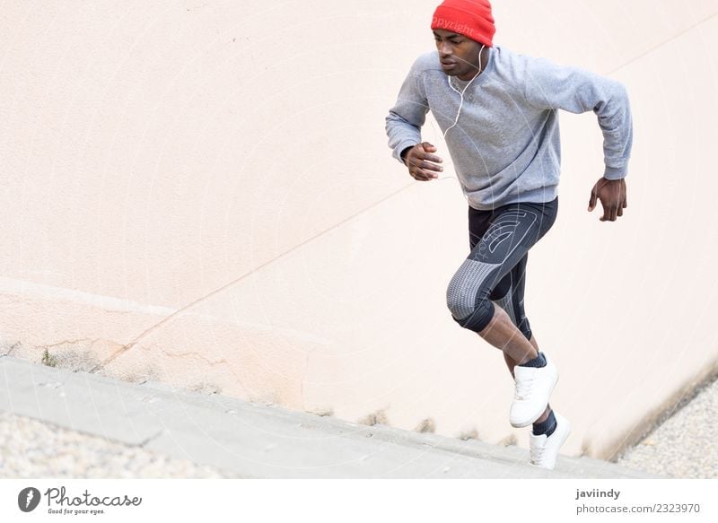 Black man running upstairs outdoors Lifestyle Winter Sports Jogging Human being Masculine Young man Youth (Young adults) Man Adults 1 18 - 30 years Fitness