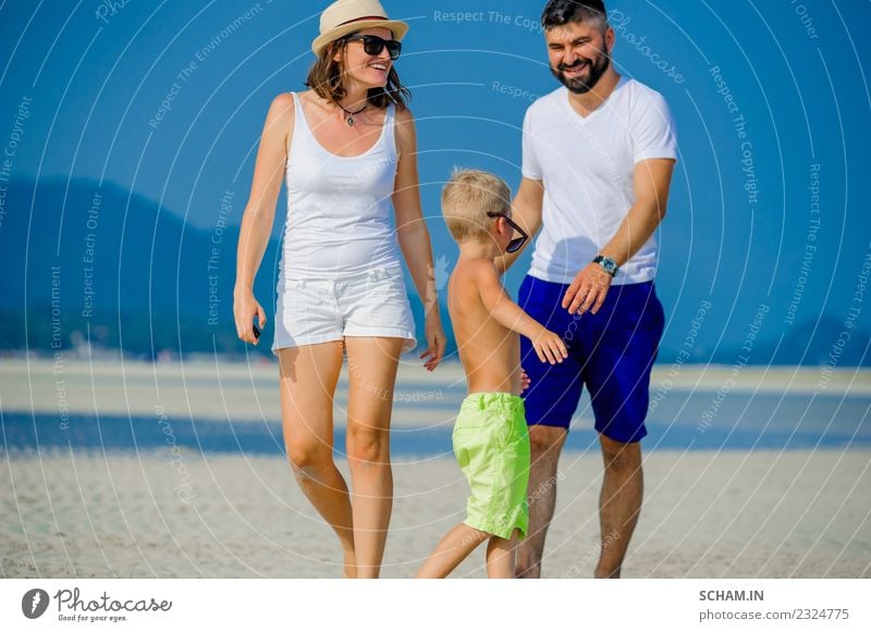 Happy young family of three Lifestyle Joy Playing Summer Ocean Island Infancy Group Sunglasses Beard Smiling Happiness Together 30-34 years 8-9 years Ko Samui