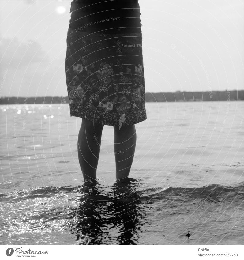 At Wannsee Human being Feminine Woman Adults Legs 1 Water Lakeside Skirt Relaxation To enjoy Stand Gray Vacation & Travel Nature Black & white photo