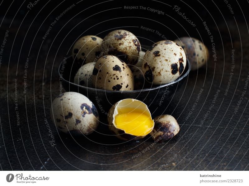 Quail eggs in a bowl on a dark background Food Breakfast Bowl Decoration Feasts & Celebrations Easter Dark Fresh Small Natural Retro Yellow White Tradition