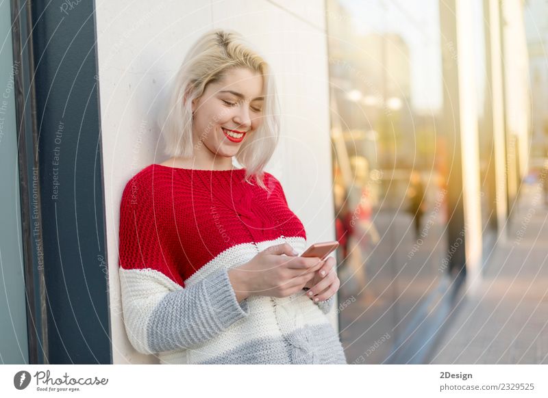 Blonde young woman chatting outdoors Lifestyle Joy Happy Beautiful University & College student Telecommunications Business To talk Telephone Cellphone PDA