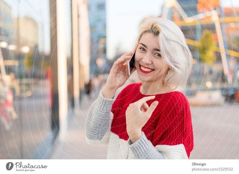 Beautiful woman using mobile in the street. Lifestyle Happy Business To talk Telephone Cellphone PDA Technology Telecommunications Internet Human being Feminine