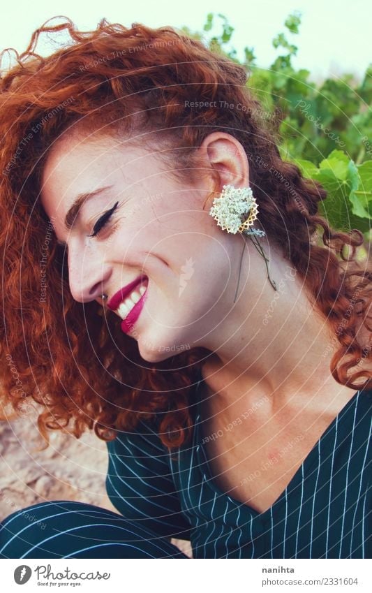 Young redhead woman with flowers as earring Lifestyle Style Design Joy Beautiful Hair and hairstyles Skin Face Make-up Wellness Harmonious Senses Human being