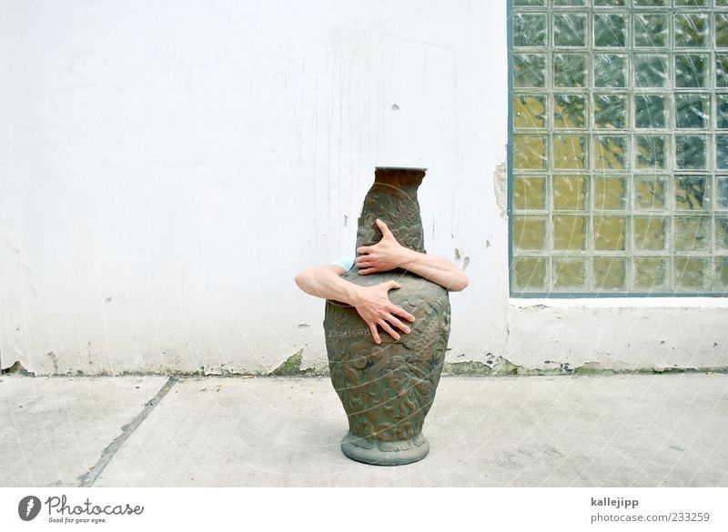 kiss me kate Human being Masculine Arm Hand Fingers 1 Embrace Vase Water jug China Porcelain Chinese Glass block Facade Colour photo Exterior shot Light Shadow