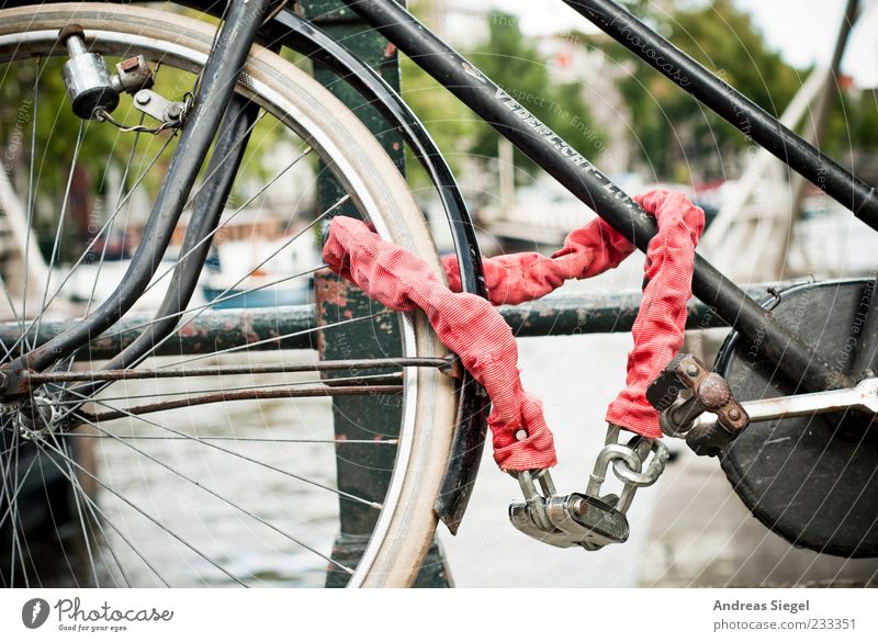 terminating property Summer Amsterdam Bridge railing Means of transport Bicycle Chain Lock Metal Stand Old Authentic Gloomy Red Associated Parking Colour photo