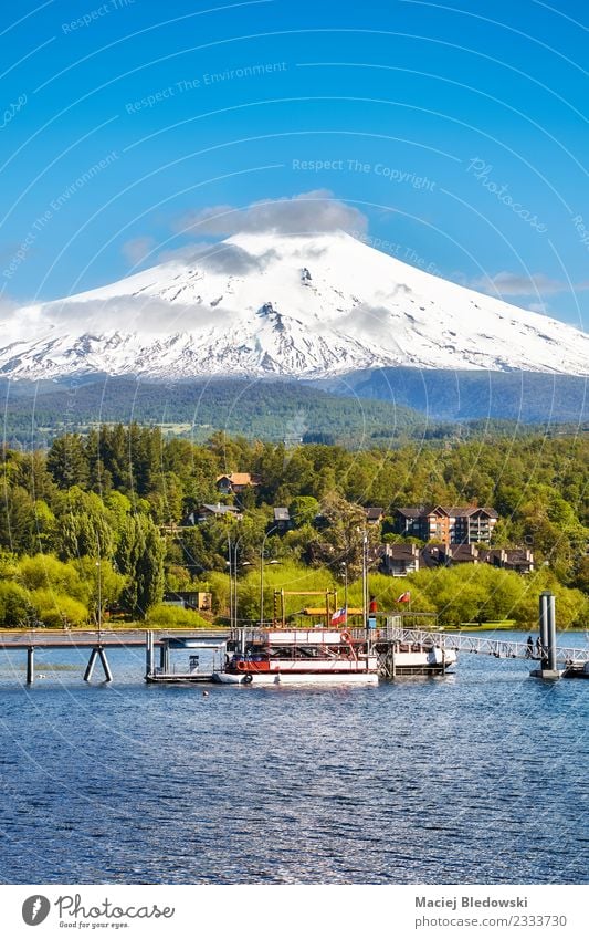 Villarrica volcano seen from Pucon, Chile. Beautiful Vacation & Travel Tourism Trip Adventure Expedition Snow Mountain Nature Landscape Sky Volcano Lake Blue