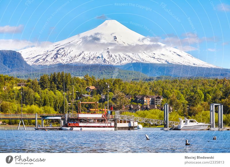 Villarrica volcanoe seen from Pucon, Chile. Vacation & Travel Tourism Trip Adventure Expedition Snow Nature Landscape Sky Tree Forest Volcano Lake Watercraft