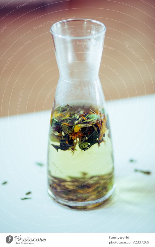 Carafe on white table with herbal tea Tea Healthy Above Fasting Diet Hot Misted up Decanter White Table Detached Blossom Herb tea Herbs and spices Fresh