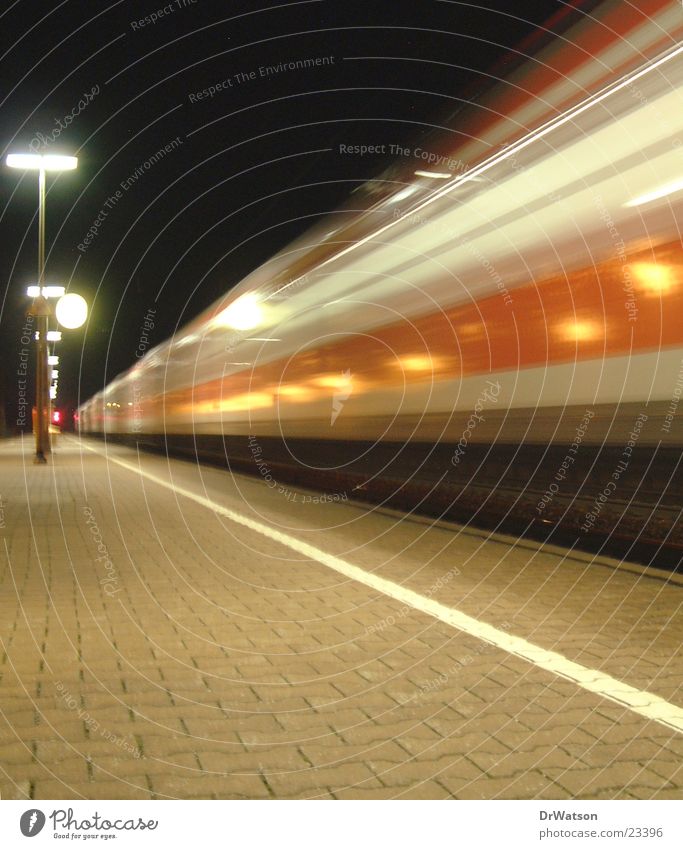 Arriving train Railroad Platform Night Movement Driving Long exposure Motion blur Transport Train station