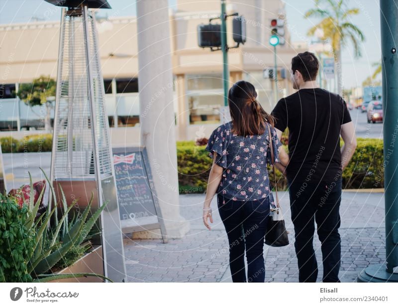 Young couple walking through the city Lifestyle Joy Leisure and hobbies Human being Young woman Youth (Young adults) Young man Woman Adults Man