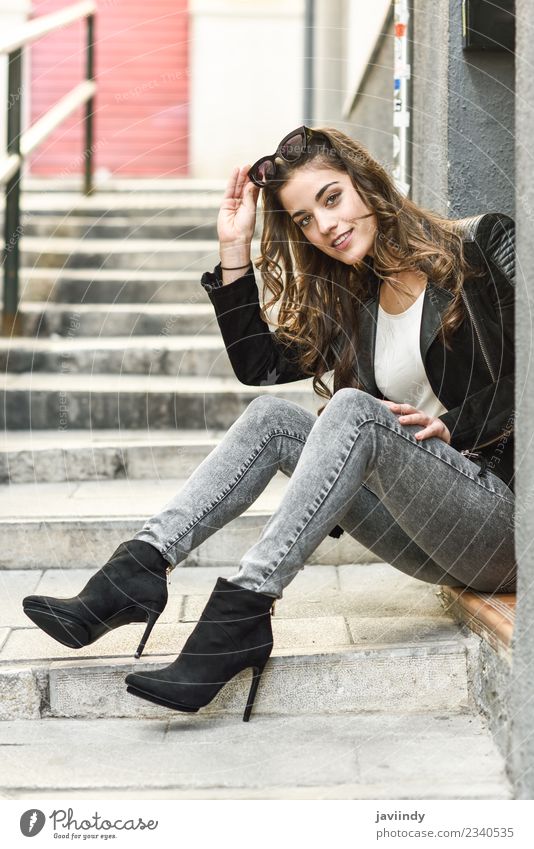 Portrait of young woman sitting on urban step Lifestyle Style Happy Beautiful Hair and hairstyles Face Human being Feminine Woman Adults Youth (Young adults) 1