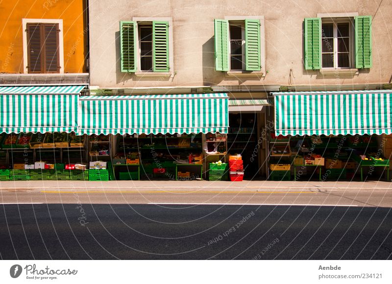 shop front Food Vegetable Fruit Nutrition Summer Lucerne Switzerland Deserted Wall (barrier) Wall (building) Facade Esthetic Friendliness Historic Yellow Green