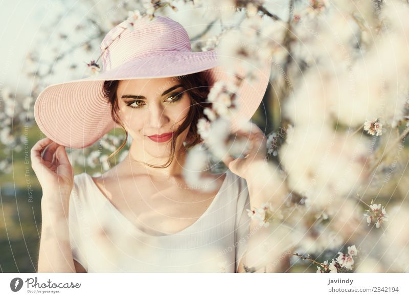 Young woman between almonds flowers in spring time Style Beautiful Face Human being Feminine Youth (Young adults) Woman Adults 1 18 - 30 years Flower Fashion