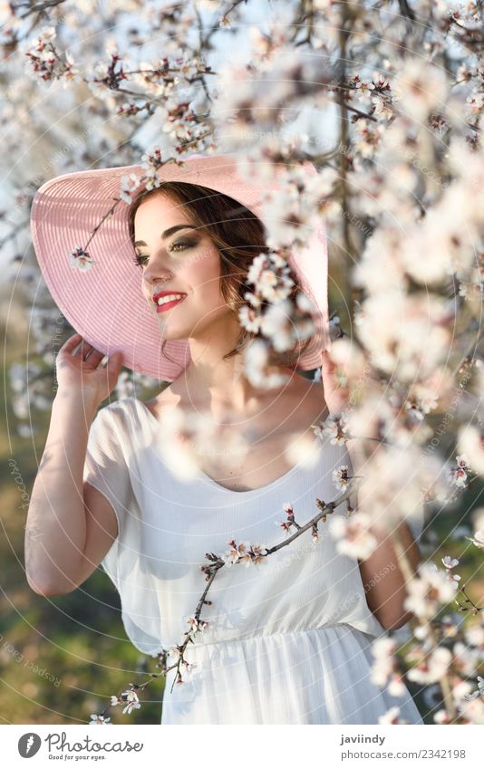 Young woman in almond flowered field in spring time Style Beautiful Human being Feminine Youth (Young adults) Woman Adults 1 18 - 30 years Nature Tree Flower