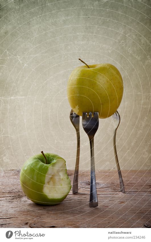 Two apples Food Fruit Apple Nutrition Organic produce Vegetarian diet Diet Fork Wood Metal Esthetic Exceptional Brown Yellow Green Colour photo Interior shot