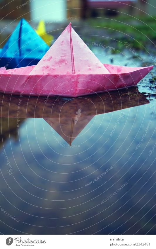 Color paper boats in the water Environment Nature Water Drops of water Autumn Winter Climate Weather Bad weather Rain Toys Paper Paper boat Puddle Authentic