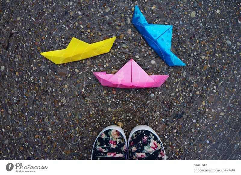Three color paper boats in the ground Lifestyle Leisure and hobbies Playing Children's game Drops of water Weather Rain Origami Arts and crafts  Paper