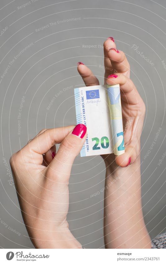 € 20 ticket held by a woman. Shopping Happy Money Manicure Nail polish Feminine Hand Observe To enjoy Cool (slang) Astute Interior shot Studio shot
