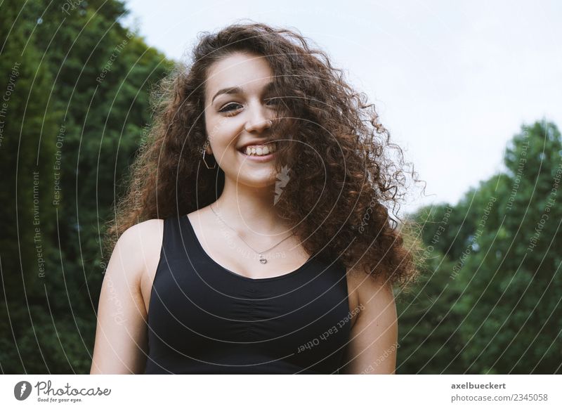 young Spaniard with curly hair Lifestyle Joy Human being Feminine Young woman Youth (Young adults) Woman Adults 1 13 - 18 years Nature Tree Park Brunette