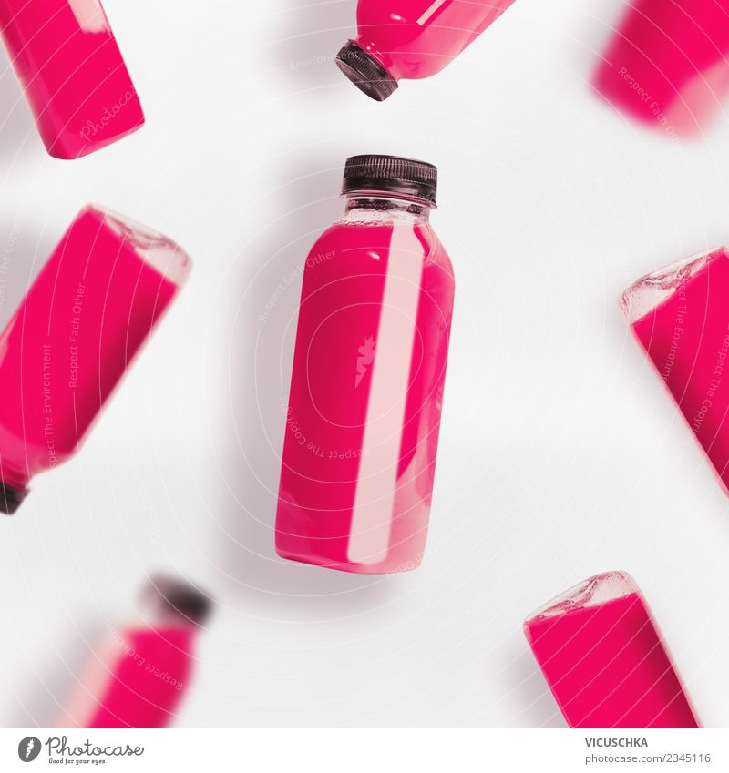 Pink smoothie or juice bottles on white background Food Fruit Organic produce Vegetarian diet Diet Beverage Drinking Cold drink Juice Bottle Style Design Summer