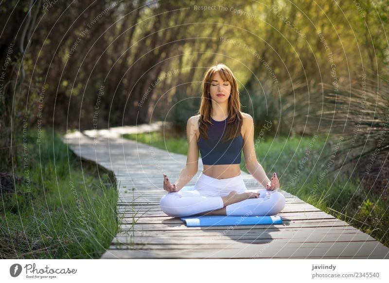 Young woman doing yoga in nature. Lifestyle Relaxation Meditation Summer Sports Yoga Human being Feminine Youth (Young adults) Woman Adults 1 18 - 30 years