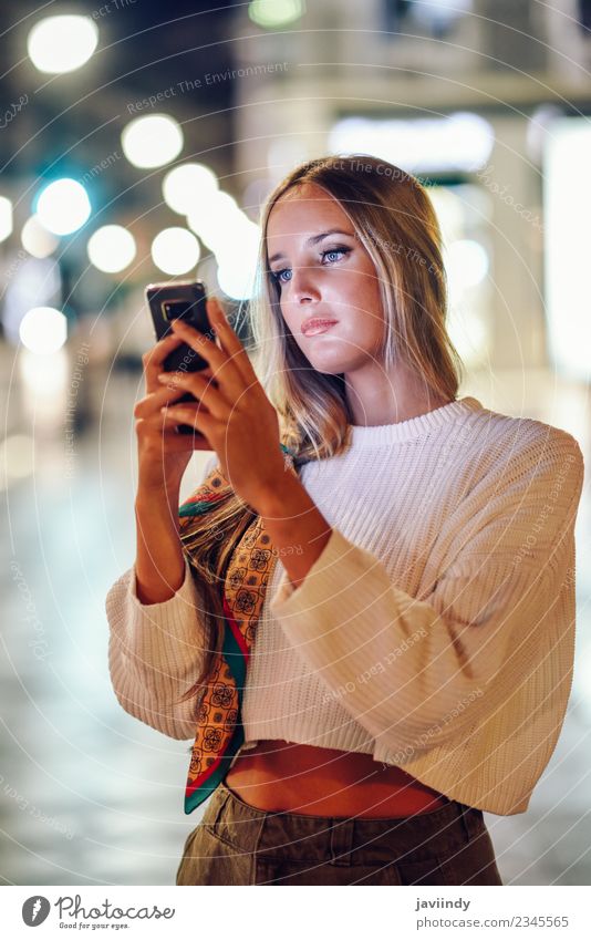 Blonde woman taking photograph with smartphone at night in the street Lifestyle Style Beautiful Hair and hairstyles Telephone PDA Camera Human being Young woman