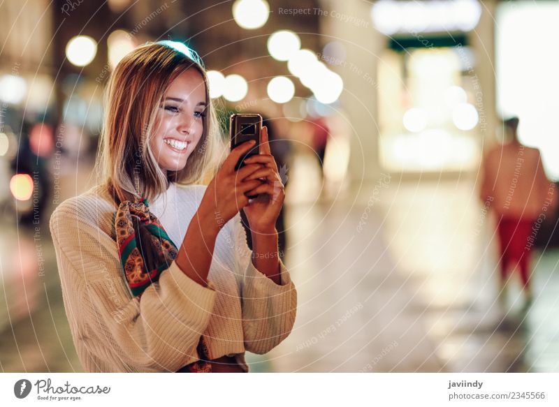 Blonde woman taking photograph with smartphone at night Lifestyle Beautiful Telephone PDA Camera Human being Feminine Young woman Youth (Young adults) Woman