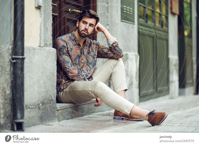 Young bearded man, model of fashion, sitting on urban step Lifestyle Style Beautiful Hair and hairstyles Human being Masculine Man Adults Youth (Young adults) 1