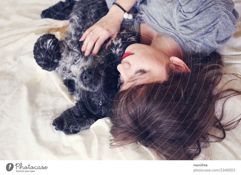 Young woman sleeping with her dog Lifestyle Beautiful Relaxation Bed Human being Feminine Youth (Young adults) Friendship 1 18 - 30 years Adults Animal Pet Dog