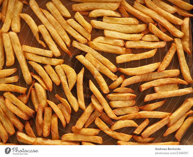 Oven French fries from organic potatoes Nutrition Lunch Organic produce Vegetarian diet Style Delicious Yellow natural baked baking sheet food