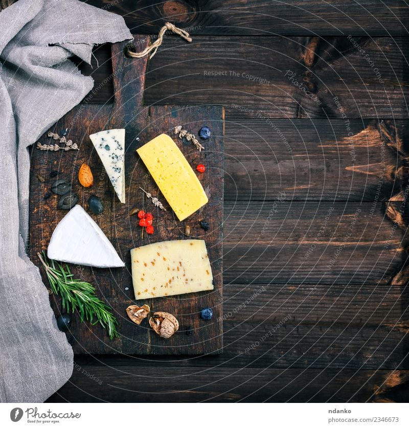 pieces of different cheeses Cheese Table Wood Old Eating Blue Yellow White board Brie roquefort cheddar Difference food Meal Snack Gourmet Ingredients french