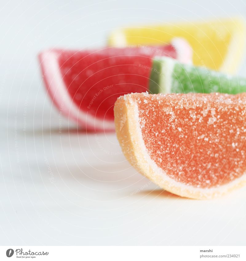 eat half Food Candy Nutrition Yellow Green Red Sugar Calorie Rich in calories Sweet Half Blur Isolated Image Unhealthy Sweet and sour Colour photo Interior shot