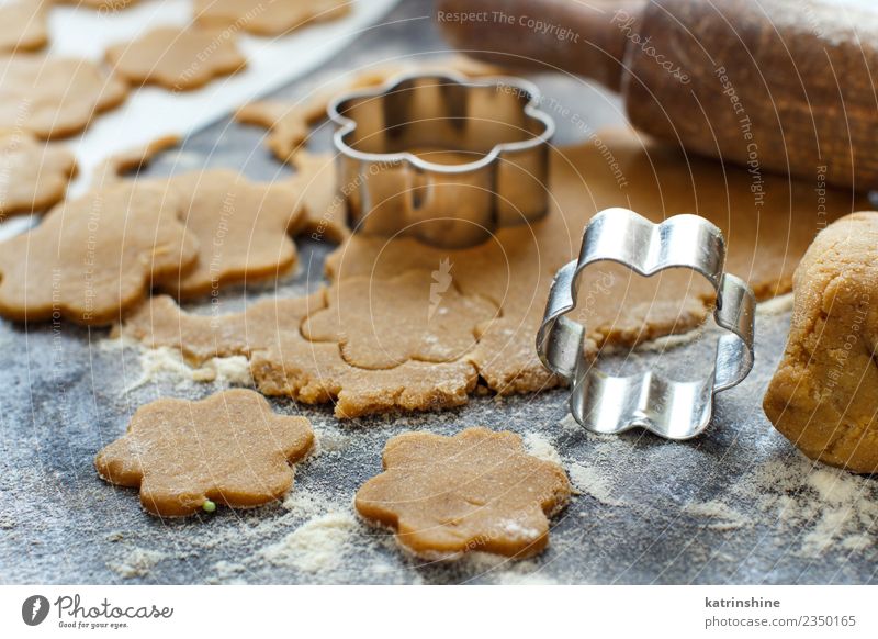 Cooking cookies with cookie cutters on a dark table Dough Baked goods Dessert Kitchen Flower Metal Make Brown Tradition Baking Bakery biscuit cooking